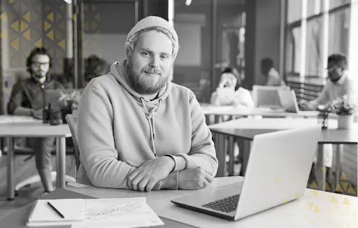 marketing professional sitting in front of laptop